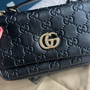 Gucci Monogramed Bag with Gold Hardware